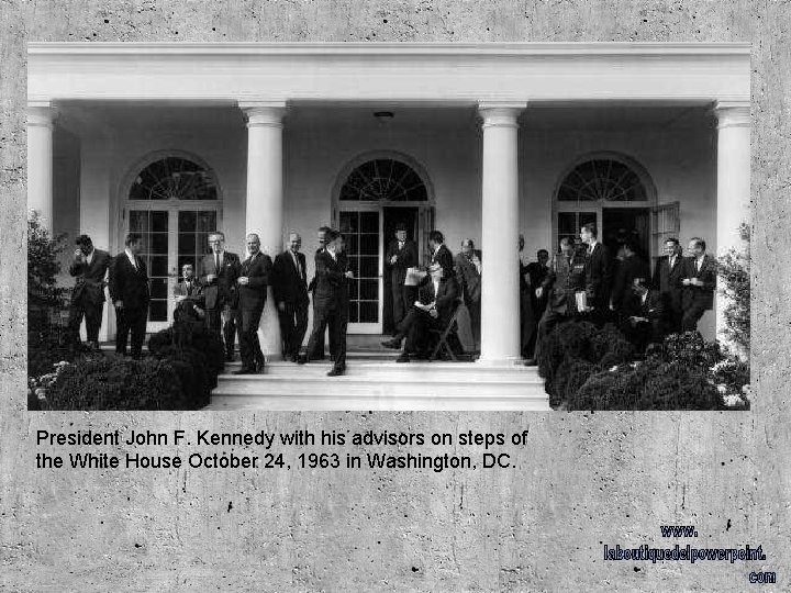 President John F. Kennedy with his advisors on steps of the White House October