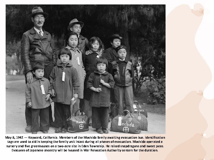 May 8, 1942 — Hayward, California. Members of the Mochida family awaiting evacuation bus.