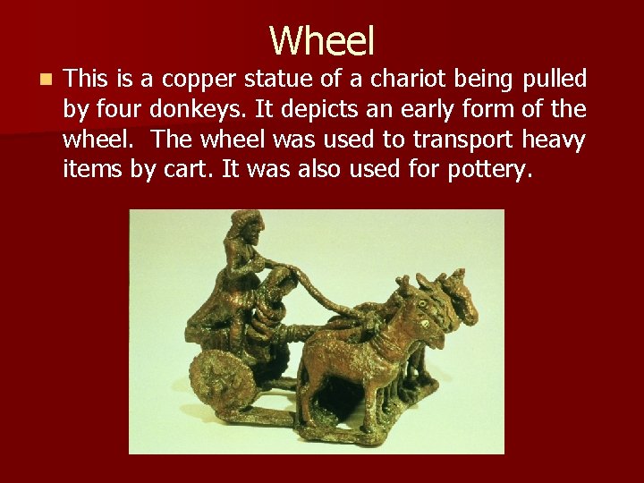 Wheel n This is a copper statue of a chariot being pulled by four