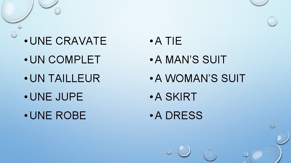  • UNE CRAVATE • A TIE • UN COMPLET • A MAN’S SUIT