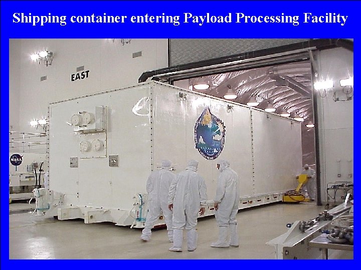 Shipping container entering Payload Processing Facility 