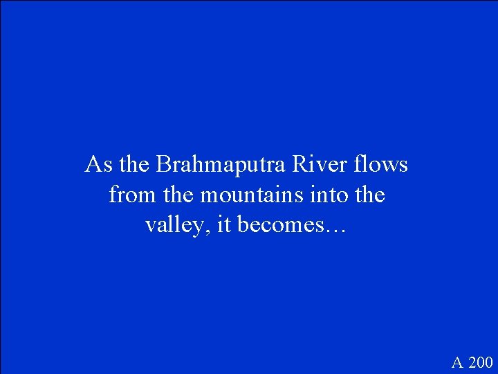 As the Brahmaputra River flows from the mountains into the valley, it becomes… A
