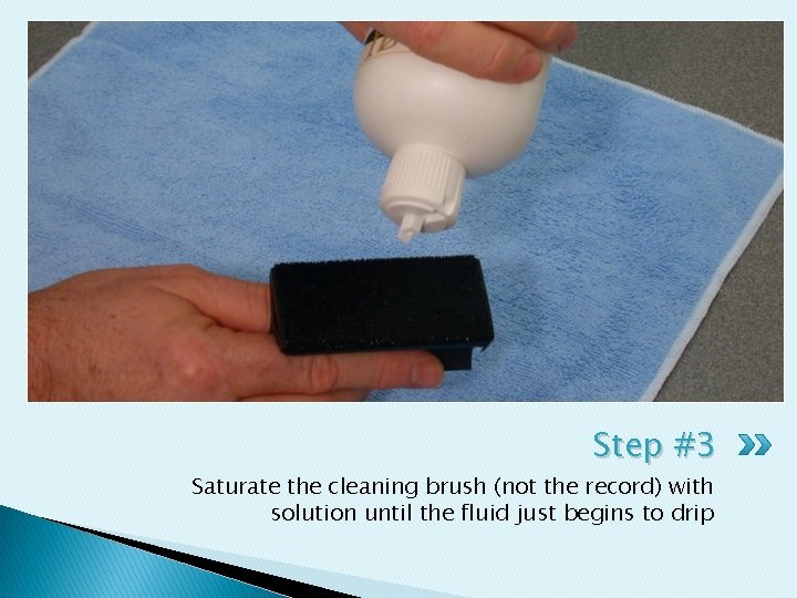 Step #3 Saturate the cleaning brush (not the record) with solution until the fluid