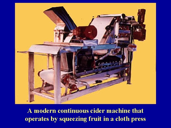 A modern continuous cider machine that operates by squeezing fruit in a cloth press