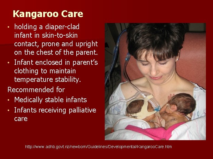 Kangaroo Care holding a diaper-clad infant in skin-to-skin contact, prone and upright on the