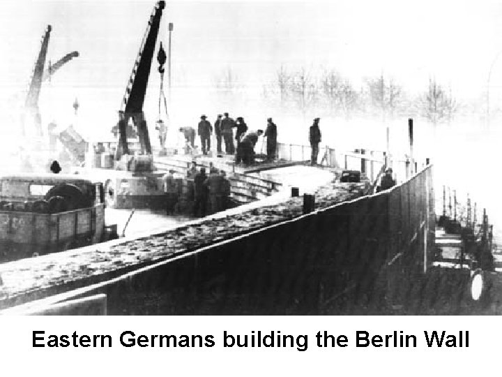 Eastern Germans building the Berlin Wall 