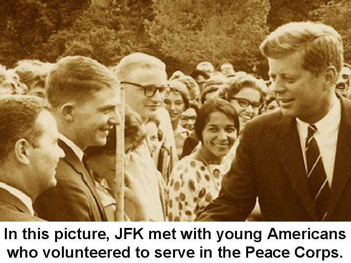 In this picture, JFK met with young Americans who volunteered to serve in the