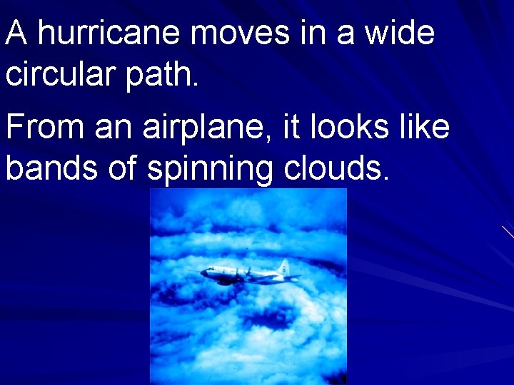 A hurricane moves in a wide circular path. From an airplane, it looks like