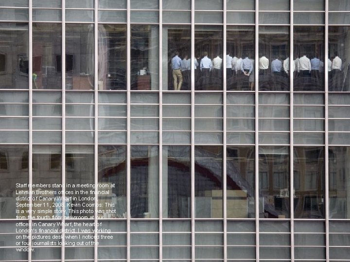Staff members stand in a meeting room at Lehman Brothers offices in the financial