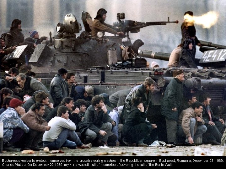 Bucharest's residents protect themselves from the crossfire during clashes in the Republican square in