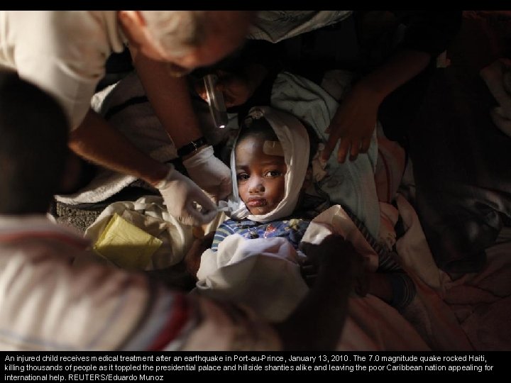 An injured child receives medical treatment after an earthquake in Port-au-Prince, January 13, 2010.