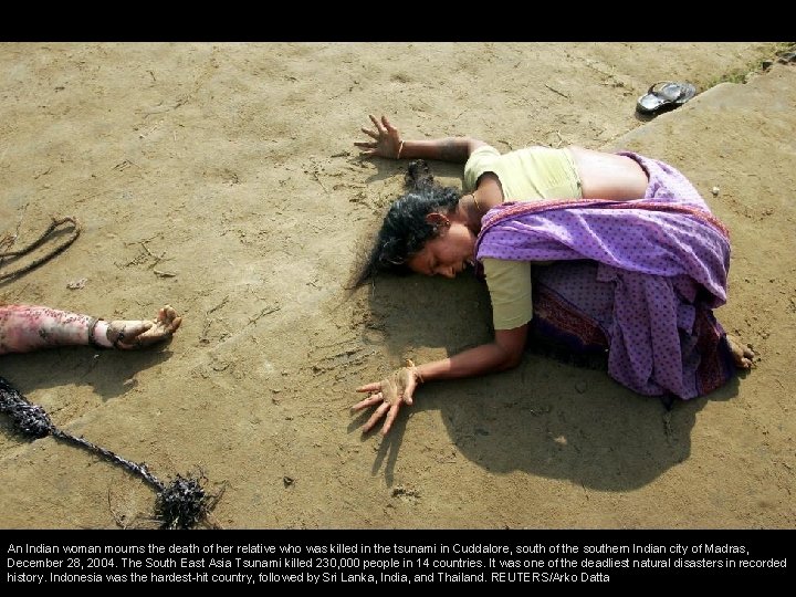 An Indian woman mourns the death of her relative who was killed in the