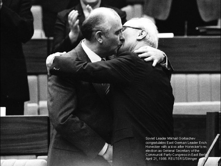 Soviet Leader Mikhail Gorbachev congratulates East German Leader Erich Honecker with a kiss after