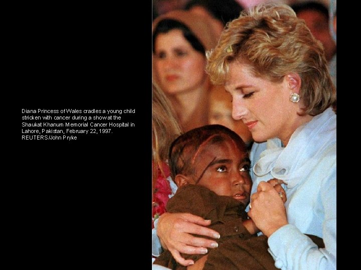 Diana Princess of Wales cradles a young child stricken with cancer during a show