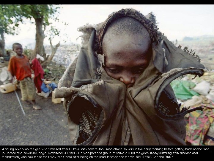 A young Rwandan refugee who travelled from Bukavu with several thousand others shivers in
