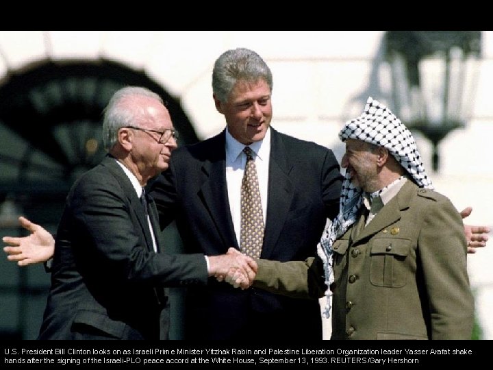U. S. President Bill Clinton looks on as Israeli Prime Minister Yitzhak Rabin and