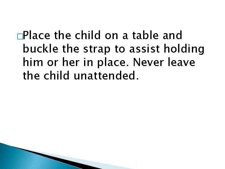 �Place the child on a table and buckle the strap to assist holding him