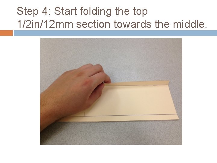 Step 4: Start folding the top 1/2 in/12 mm section towards the middle. 