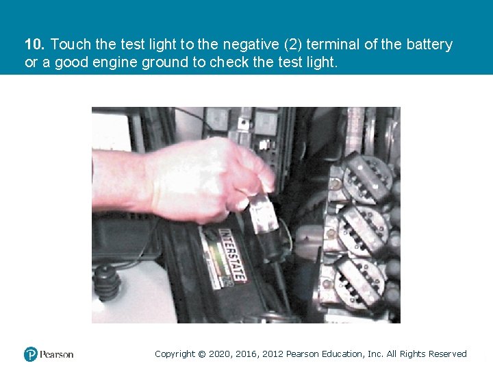 10. Touch the test light to the negative (2) terminal of the battery or