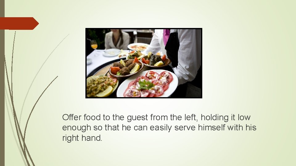 Offer food to the guest from the left, holding it low enough so that