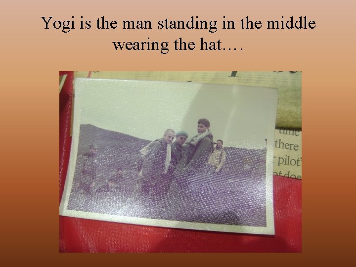 Yogi is the man standing in the middle wearing the hat…. 