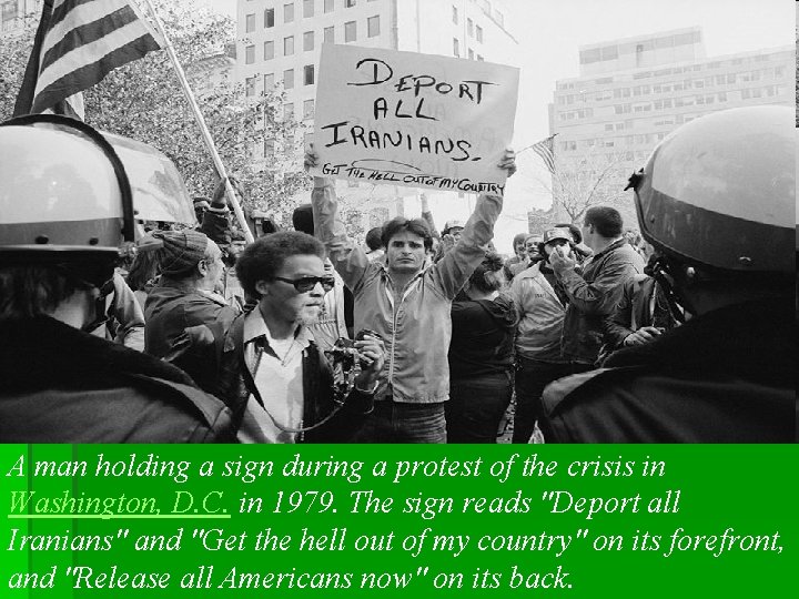 A man holding a sign during a protest of the crisis in Washington, D. A man holding a sign during a protest of the crisis in Washington, D.
