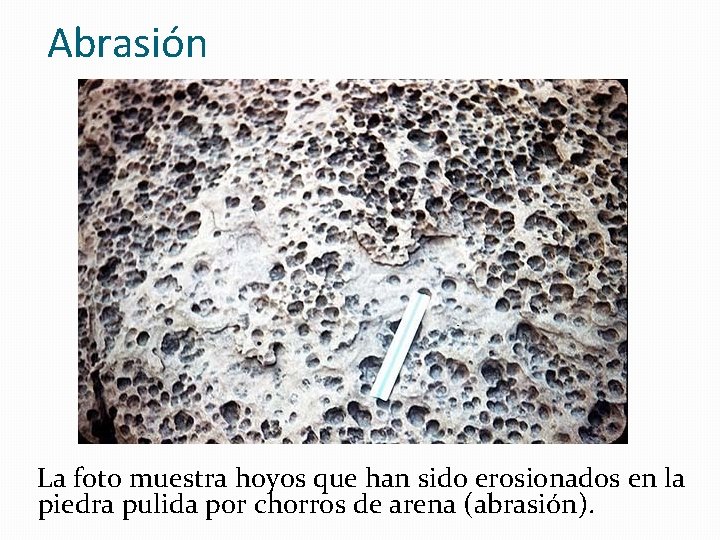 Abrasión La foto muestra hoyos que han sido erosionados en la piedra pulida por Abrasión La foto muestra hoyos que han sido erosionados en la piedra pulida por