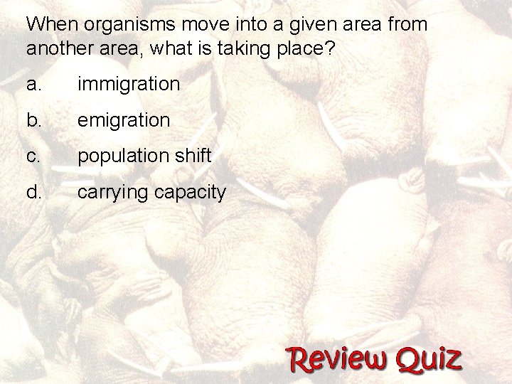 When organisms move into a given area from another area, what is taking place?