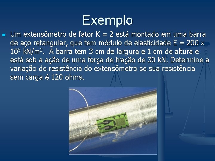 Exemplo n Um extensômetro de fator K = 2 está montado em uma barra