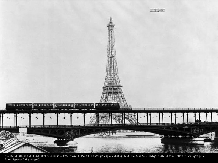 The Comte Charles de Lambert flies around the Eiffel Tower in Paris in his