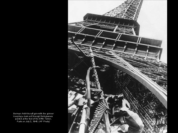 German Anti-Aircraft gun-with the gunner keeping a look-out through field glasses posted at the