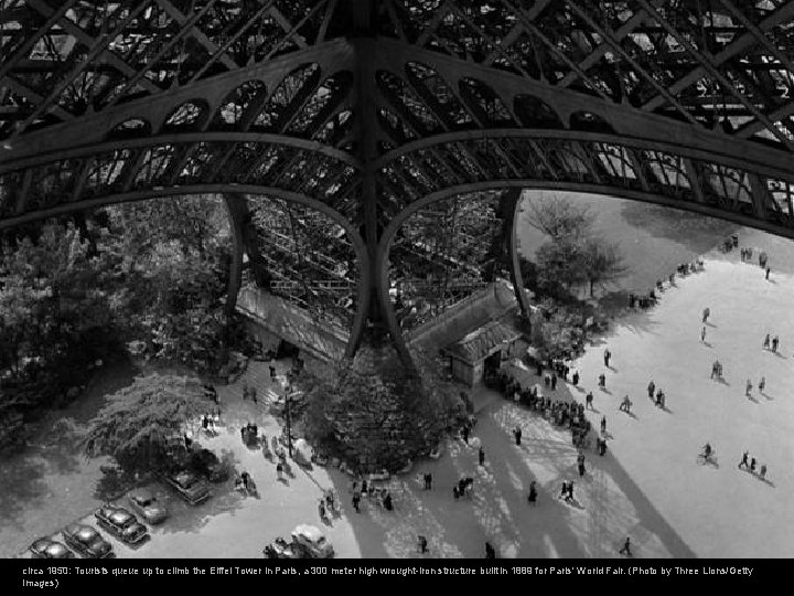 circa 1950: Tourists queue up to climb the Eiffel Tower in Paris, a 300