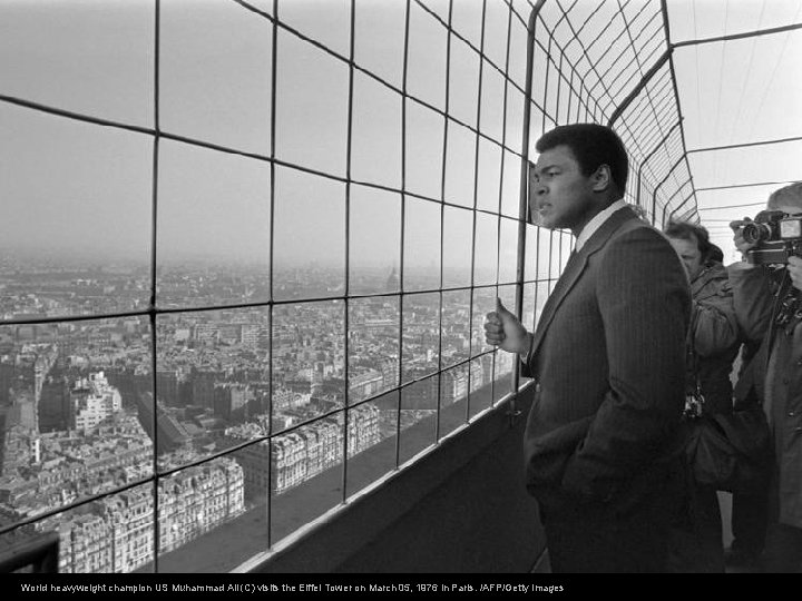 World heavyweight champion US Muhammad Ali (C) visits the Eiffel Tower on March 05,