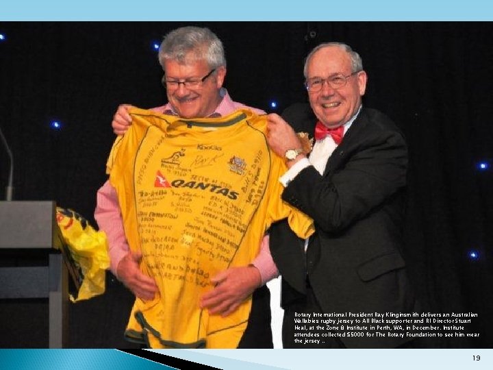 Rotary International President Ray Klinginsmith delivers an Australian Wallabies rugby jersey to All Black