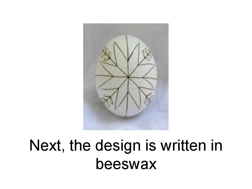 Next, the design is written in beeswax 