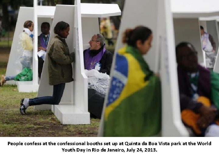 People confess at the confessional booths set up at Quinta da Boa Vista park