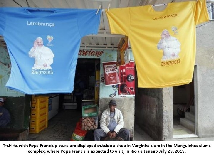 T-shirts with Pope Francis picture are displayed outside a shop in Varginha slum in