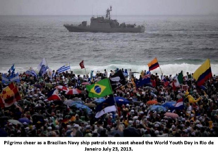 Pilgrims cheer as a Brazilian Navy ship patrols the coast ahead the World Youth