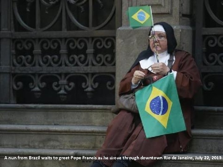 por: through downtown Rio de Janeiro, July 22, 2013. A nun from Brazil waits