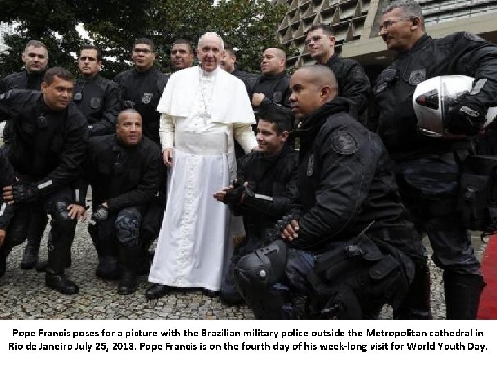 Pope Francis poses for a picture with the Brazilian military police outside the Metropolitan