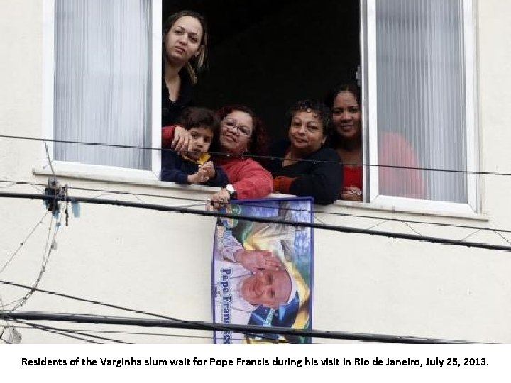 Residents of the Varginha slum wait for Pope Francis during his visit in Rio