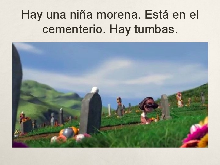 Hay una niña morena. Está en el cementerio. Hay tumbas. 