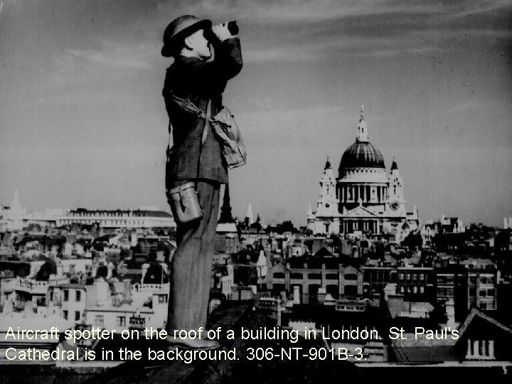 Aircraft spotter on the roof of a building in London. St. Paul's Cathedral is