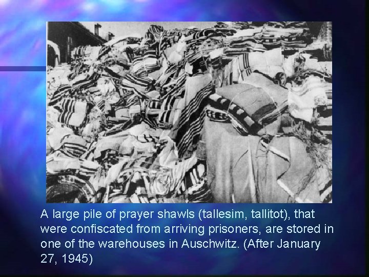 A large pile of prayer shawls (tallesim, tallitot), that were confiscated from arriving prisoners,