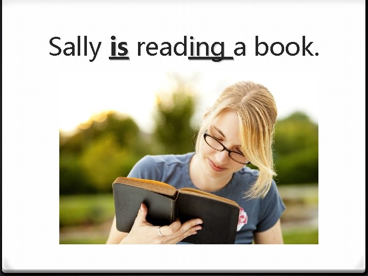 Sally is reading a book. 