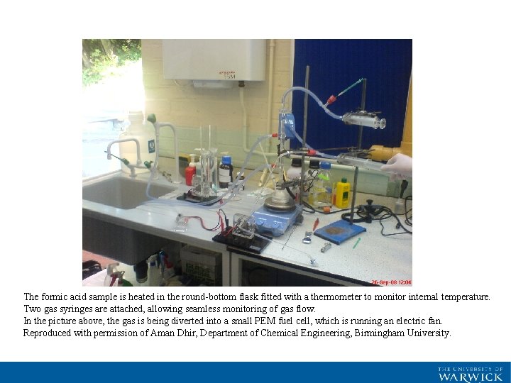 The formic acid sample is heated in the round-bottom flask fitted with a thermometer The formic acid sample is heated in the round-bottom flask fitted with a thermometer