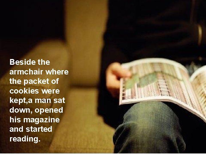 Beside the armchair where the packet of cookies were kept, a man sat down,