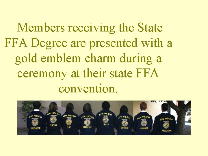 Members receiving the State FFA Degree are presented with a gold emblem charm during