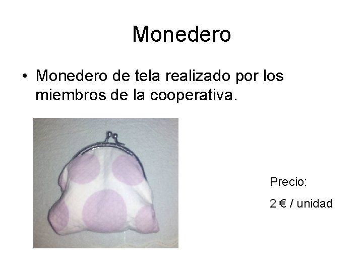 Monedero • Monedero de tela realizado por los miembros de la cooperativa. Precio: 2