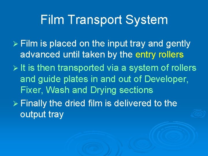 Film Transport System Ø Film is placed on the input tray and gently advanced